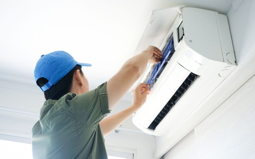 HVAC technician servicing a ductless mini split in San Rafael