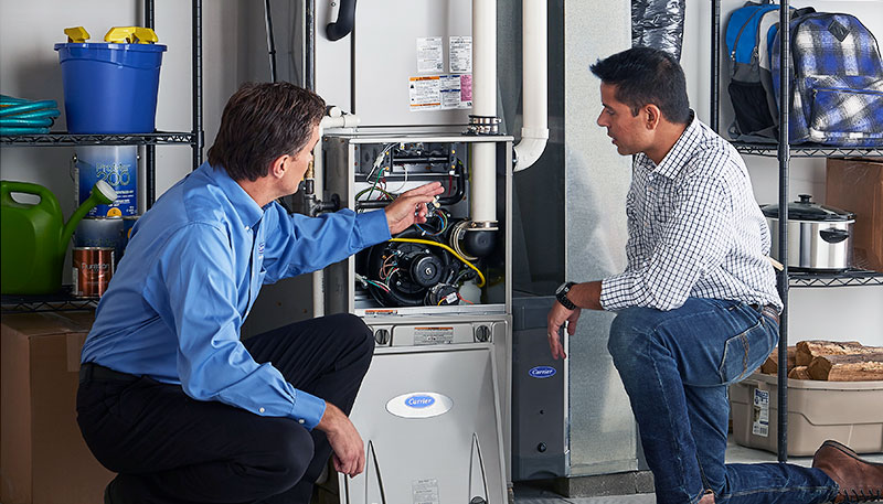 Technician evaluating a furnace for repair or replacement in San Rafael