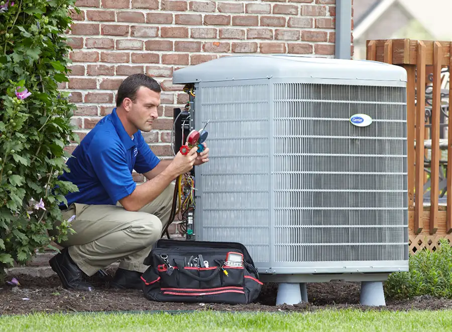 HVAC technician inspecting an outdoor AC unit in San Rafael
