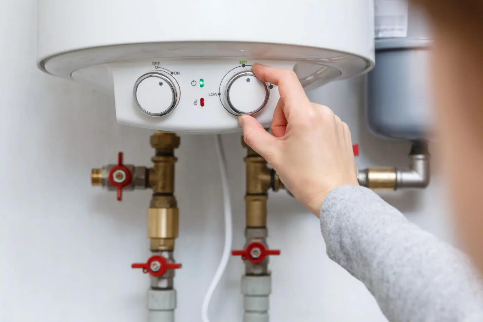 Technician adjusting a water heater in San Rafael