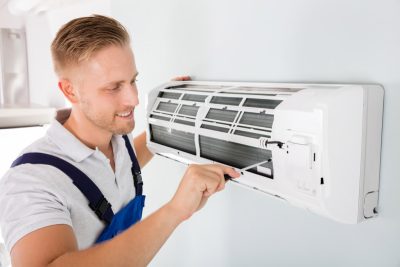 HVAC technician maintaining a ductless air conditioner in San Rafael